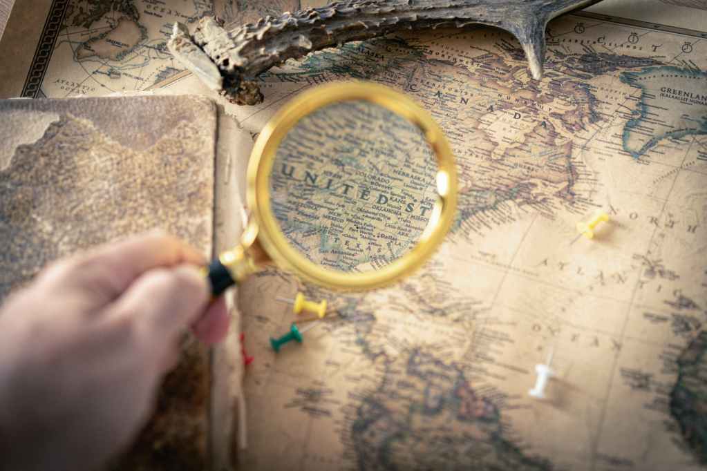 person holding magnifying glass